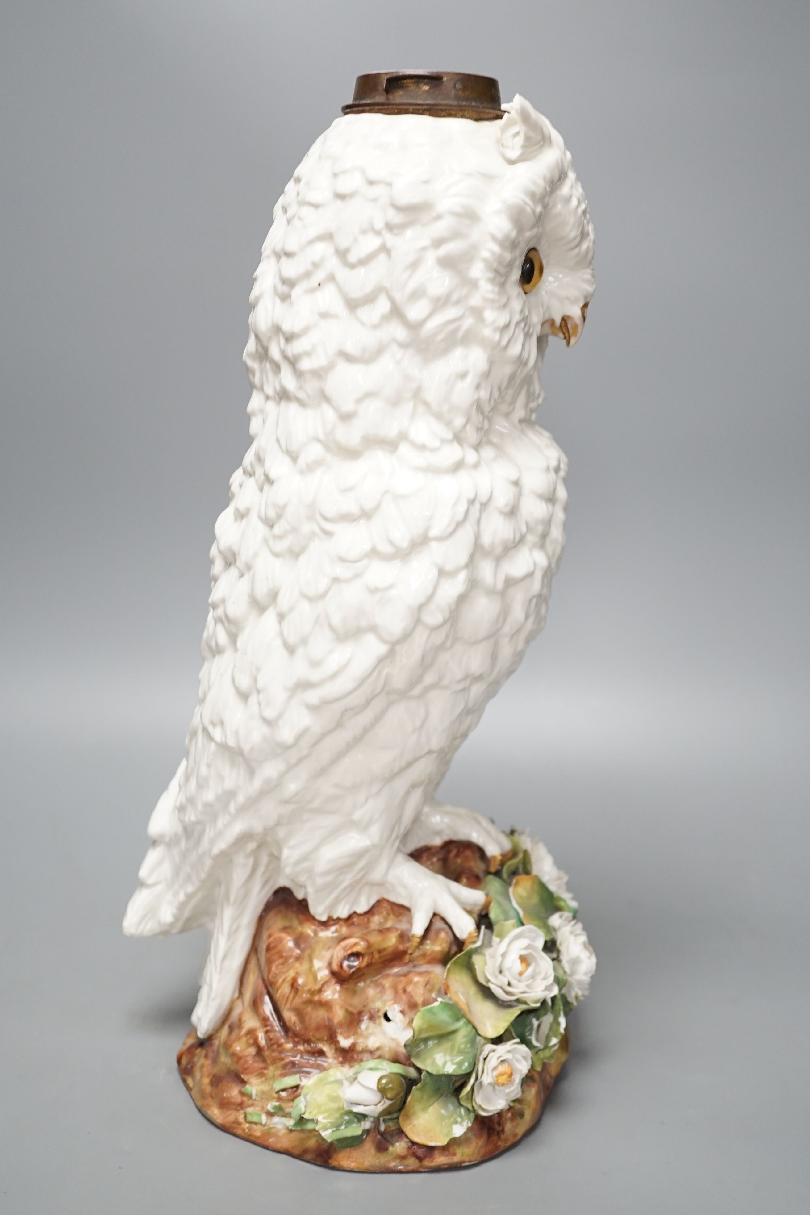 A large late 19th century ‘owl’ porcelain oil lamp base, with Victorian lozenge registration mark to base, probably Sitzendorf, 46 cms high.